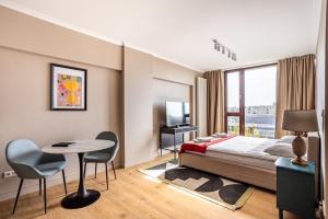 Posteľ alebo postele v izbe v ubytovaní Triton Park Apartments