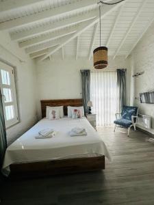 Ένα ή περισσότερα κρεβάτια σε δωμάτιο στο Boreas Otel Alaçatı +11 φωτογραφίες