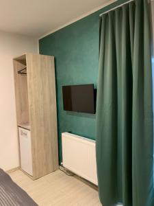 TV a/nebo společenská místnost v ubytování Neversea house + 15 fotografií