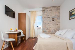 Postel nebo postele na pokoji v ubytování Rooms Supreme Spalato