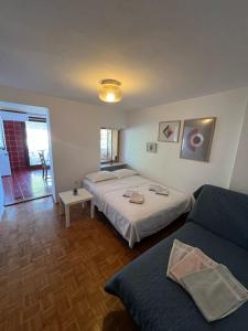 a hotel room with two beds and a window at Apartment Novigrad in Novigrad Istria