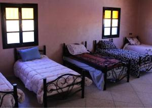 Ένα ή περισσότερα κρεβάτια σε δωμάτιο στο Hotel Kasbah Telouet