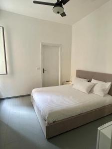 En eller flere senge i et værelse på Nuovo appartamento - Casa D'Amaldi