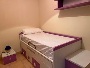 A bed or beds in a room at Residencial Los Almendros Playa Romana