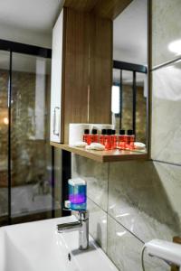 a bathroom with a sink and a faucet at LAOS OTEL in Istanbul