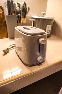 a toaster sitting on top of a kitchen counter at DMall Central Stn 2 Near Beach in Boracay +27 photos