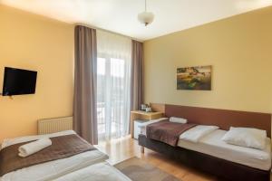 Posteľ alebo postele v izbe v ubytovaní Villa Zdrój