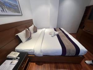 Ένα ή περισσότερα κρεβάτια σε δωμάτιο στο Hotel New Era