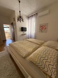 Ein Bett oder Betten in einem Zimmer der Unterkunft Apartment Batinica