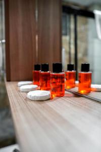 a row of four bottles of soap on a table at LAOS OTEL in Istanbul