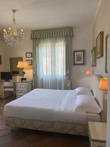 Postel nebo postele na pokoji v ubytování L'Elisea Maison De Charme
