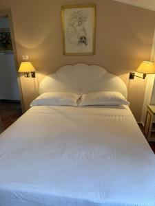 Postel nebo postele na pokoji v ubytování L'Elisea Maison De Charme
