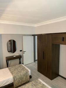 Кровать или кровати в номере Ida Hotel