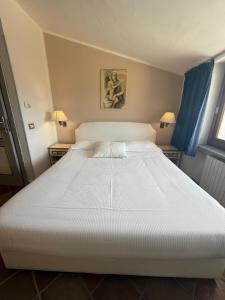 Postel nebo postele na pokoji v ubytování L'Elisea Maison De Charme