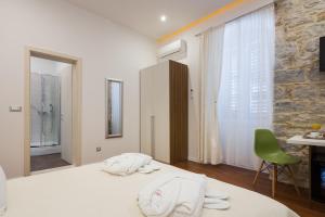 Postel nebo postele na pokoji v ubytování Rooms Supreme Spalato