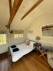 a bedroom with a large bed in a room at The Parcel Shed Gilling East in Gilling East