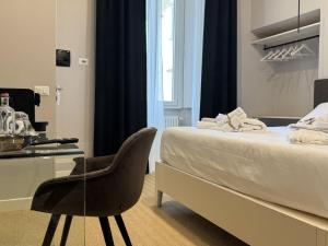 Postel nebo postele na pokoji v ubytování Amelié Lago d’Orta Hotel