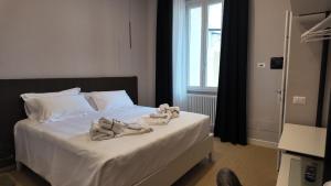 Postel nebo postele na pokoji v ubytování Amelié Lago d’Orta Hotel + 11 fotografií