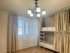 a bedroom with a bunk bed and a window at TP Central Comfort, 2 Bedroom Apartment in Ulaanbaatar