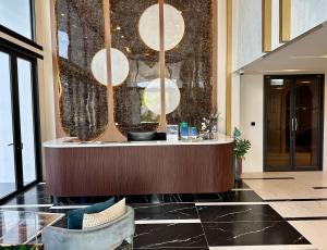 a lobby with a reception desk in a building at Bellevue lagoon 20 units in Laguna Phuket +58 photos
