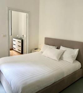 En eller flere senge i et værelse på Nuovo appartamento - Casa D'Amaldi