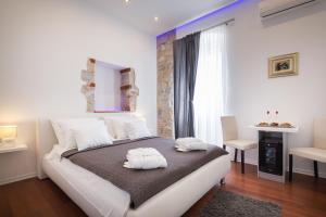 Postel nebo postele na pokoji v ubytování Rooms Supreme Spalato