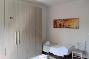 A bed or beds in a room at VENICE Sweet Home - your home in a beautiful neighborhood of the City of Venice