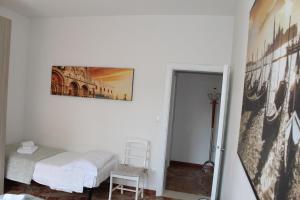 A bed or beds in a room at VENICE Sweet Home - your home in a beautiful neighborhood of the City of Venice