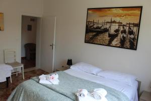 A bed or beds in a room at VENICE Sweet Home - your home in a beautiful neighborhood of the City of Venice