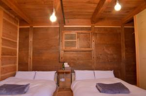 Letto o letti in una camera di 篠山城下町ゲストハウス quolo