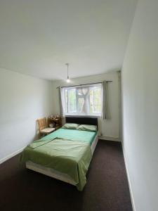 Postel nebo postele na pokoji v ubytování Ilford rooms + 6 fotografií