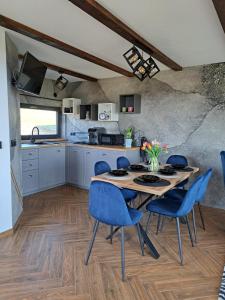 a kitchen and dining room with a table and chairs at Orawskie wzgórze in Jabłonka +33 photos