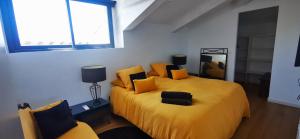 Ένα ή περισσότερα κρεβάτια σε δωμάτιο στο Appartement dans maison contemporaine