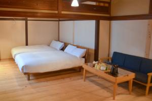 Voodi või voodid majutusasutuse 篠山城下町ゲストハウス inosica toas