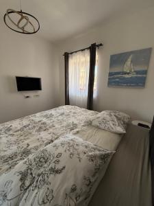 Ein Bett oder Betten in einem Zimmer der Unterkunft Apartment Batinica