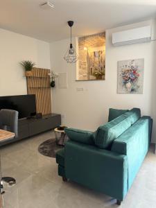 Ein Sitzbereich in der Unterkunft Apartment Batinica