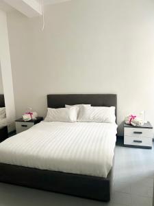 En eller flere senge i et værelse på Nuovo appartamento - Casa D'Amaldi