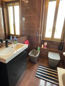 a bathroom with a sink and a toilet at Private and quiet room in Rome