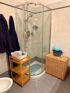a bathroom with a shower with a sink and a toilet at La Casa Blu Rimini in Rimini +12 photos
