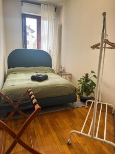a bedroom with a bed with a blue head board at La Casa Blu Rimini in Rimini