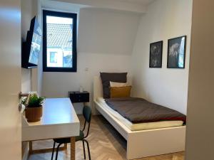 Ένα ή περισσότερα κρεβάτια σε δωμάτιο στο Moderne Masionette Wohnung +2 φωτογραφίες