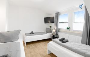 Ένα ή περισσότερα κρεβάτια σε δωμάτιο στο BEGE APARTMENTS SmallGroupStay