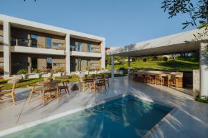 an image of a house with a swimming pool at Suite Homes - Fine Living , Preveza in Kanali