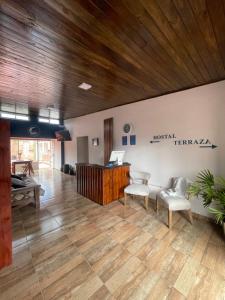 an office with a desk and two chairs in a room at LIORA Hostal in Tafí del Valle