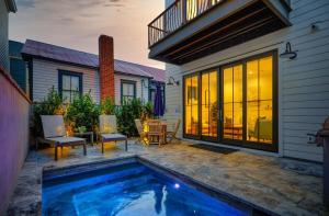 a backyard with a swimming pool and a house at The Cavalla- private pool & roof top deck in Charleston