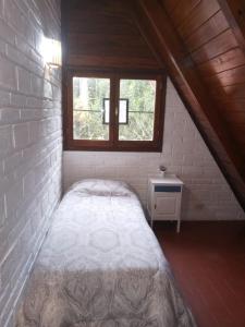 En eller flere senge i et værelse på Cabaña Colibri + 17 billeder