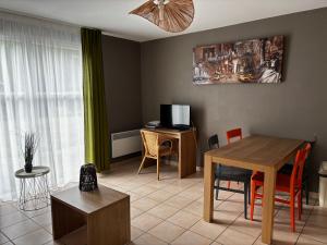 TV a/nebo společenská místnost v ubytování Cottage 102