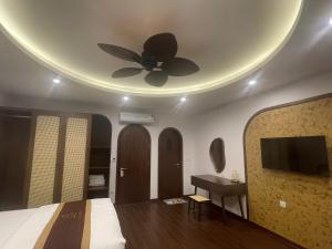 Μια τηλεόραση ή/και κέντρο ψυχαγωγίας στο Maison Homestay Pho Bien 17, Ocean Park 3