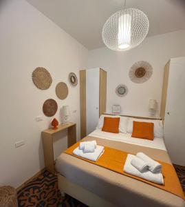 En eller flere senge i et værelse på VOGLIA D'ESTATE apartments