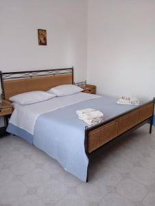 Ένα ή περισσότερα κρεβάτια σε δωμάτιο στο Oasi vacanza
